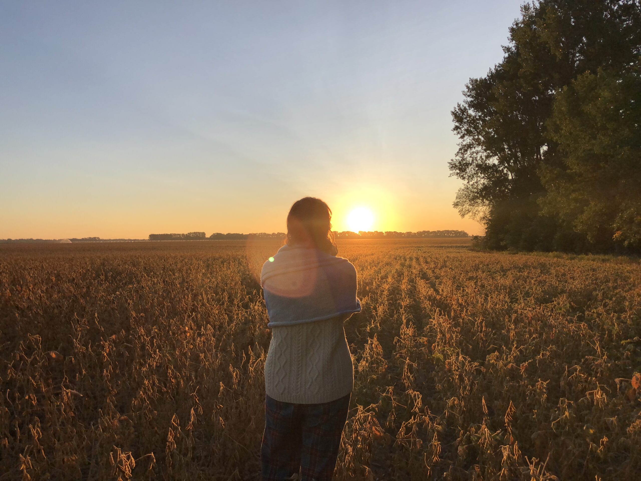 Woman standing in field.